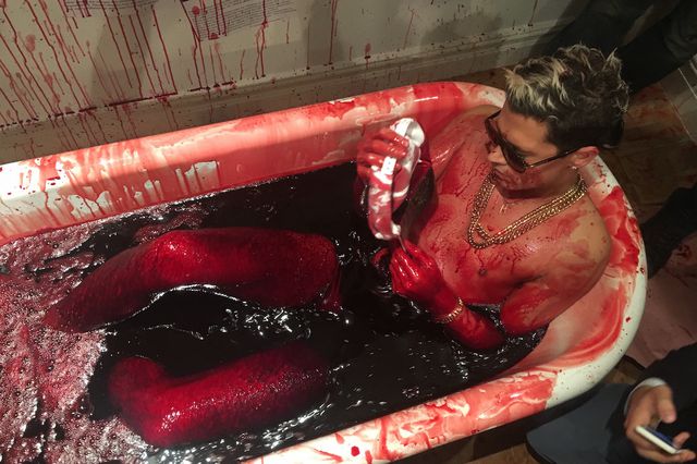 Milo Yiannopoulos bathes in pig's blood.
